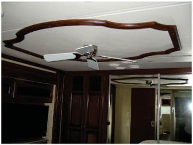 custom-coach-ceiling-trim Wooden ceiling trim displayed with fan