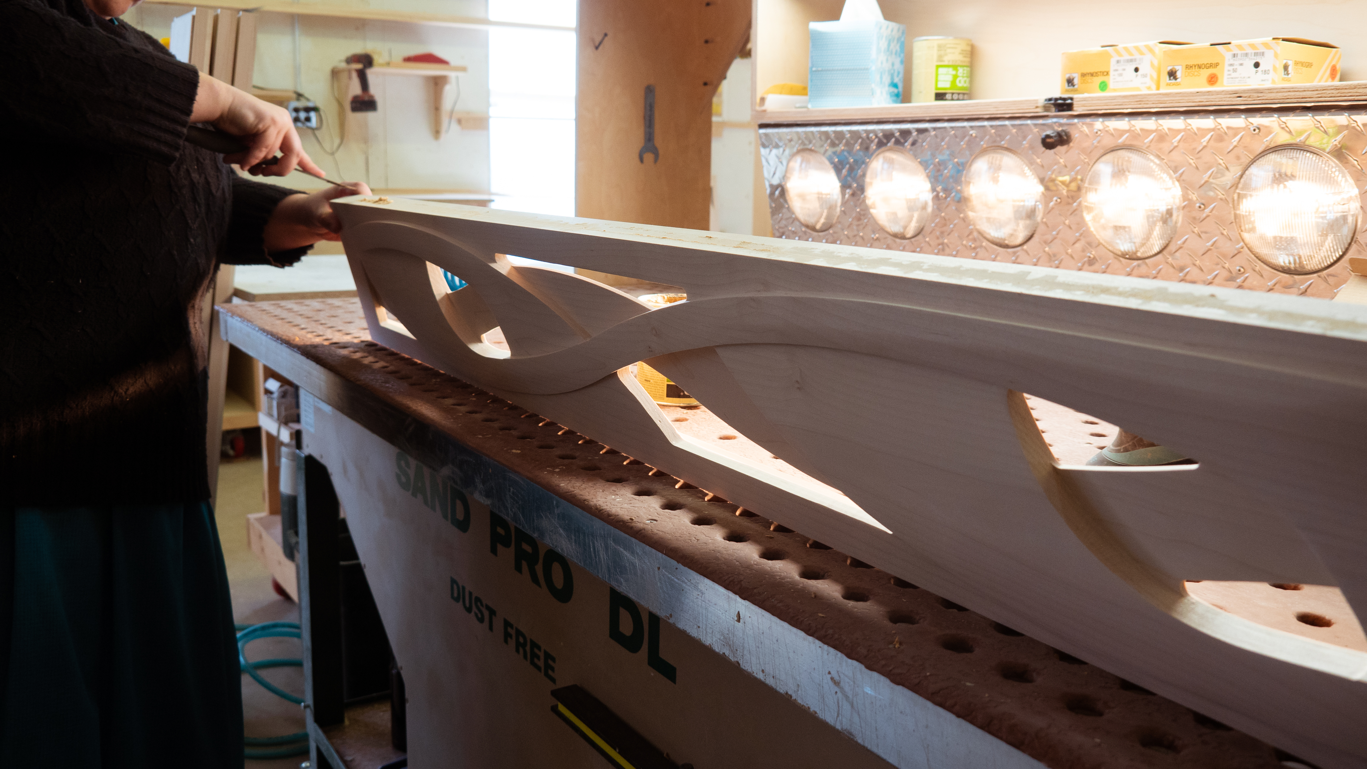 P1050429 Working on an intricate wooden piece in the workshop